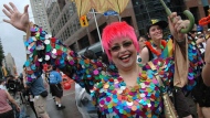 A woman throws her hands up in celebration during the 2009 Pride Parade. Courtesy of Pride Toronto