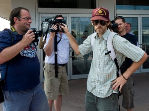 A supporter of the accused ringleaders of the G20 riots confronts media outside an Ontario Court of Justice in Toronto on Tuesday, July 6, 2010. (THE CANADIAN PRESS/Adrien Veczan)
