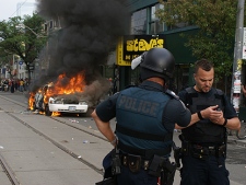 A police car burns in this file photo.