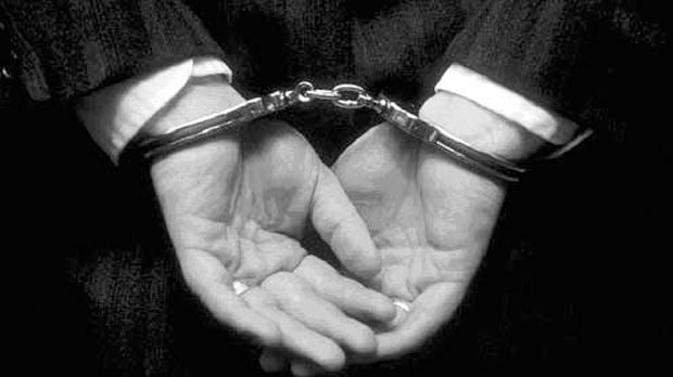 Arrest file photo, handcuffs