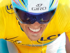 Alberto Contador of Spain, wearing the overall leader's yellow jersey, strains during the 19th stage of the Tour de France cycling race, an individual time trial over 52 kilometers with start in Bordeaux and finish in Pauillac, south western France, Saturday, July 24, 2010. (Laurent Rebours/AP Photo)