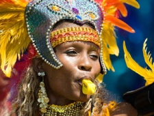 A reveler takes part in the 2010 Caribana Parade in Toronto on Saturday, July 31, 2010. (Adrien Veczan / THE CANADIAN PRESS)