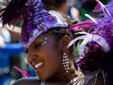 A reveler takes part in the 2010 Caribana Parade in Toronto on Saturday, July 31, 2010.