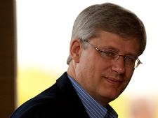 Prime Minister Stephen Harper arrives to Parliament Hill to take part in the Conservative summer caucus in Ottawa on Thursday Aug. 5, 2010. (THE CANADIAN PRESS/Sean Kilpatrick)
