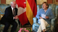 David Johnston and Angela Merkel