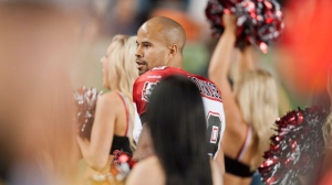 Calgary Stampeders' Jon Cornish dances with the Stampeders cheer leaders after scoring the running touchdown against the Edmonton Eskimos during the fourth quarter of the CFL football game in Edmonton, Alta., on Friday, Sept. 7, 2012. (The Canadian Press/John Ulan)