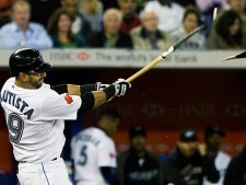 Toronto Blue Jays  right fielder Jose Bautista breaks his bat as he hits a double to left field against the Seattle Mariners during seventh inning AL action in Toronto on Tuesday, September 21, 2010. (THE CANADIAN PRESS/Nathan Denette)