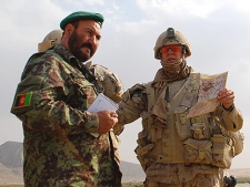 Brig. Gen. Dean Milner and Afghan National Army officer Col. Habibula examine frontline positions in Panjwaii district, Kandahar, Afghanistan. Canada's senior commander in Afghanistan  says a recent series of operations in the Panjwaii district of Kandahar has given troops momentum in their fight against the Taliban. (THE CANADIAN PRESS/Jonathan Montpetit)