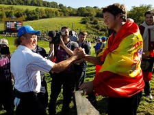 Europe's Miguel Angel Jimenez, left, is congratulated by a Spanish fan after winning his match on the final day of the 2010 Ryder Cup golf tournament at the Celtic Manor Resort in Newport, Wales, Monday, Oct. 4, 2010. (AP Photo/Jon Super)