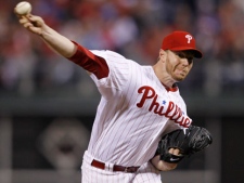 Philadelphia Phillies starting pitcher Roy Halladay delivers to a Cincinnati Reds batter during the fifth inning of Game 1 of baseball's National League Division Series, Wednesday, Oct. 6, 2010, in Philadelphia. Halladay pitched a no-hitter. The Phillies defeated the Reds 4-0.(AP Photo/Matt Slocum)