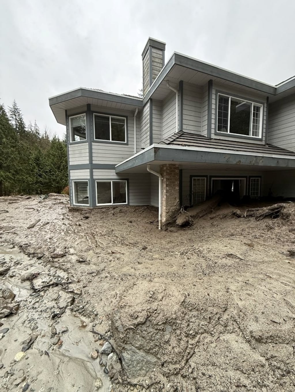 ‘It wasn’t our mud’: Elderly couple still out of their home a month after Coquitlam mudslide