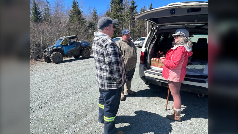 Three members of the team searching for Lilly and Jack Sullivan are pictured with vehicles near Lansdowne Station, N.S., on April 26, 2026. (Jonathan MacInnis, CTV Atlantic)