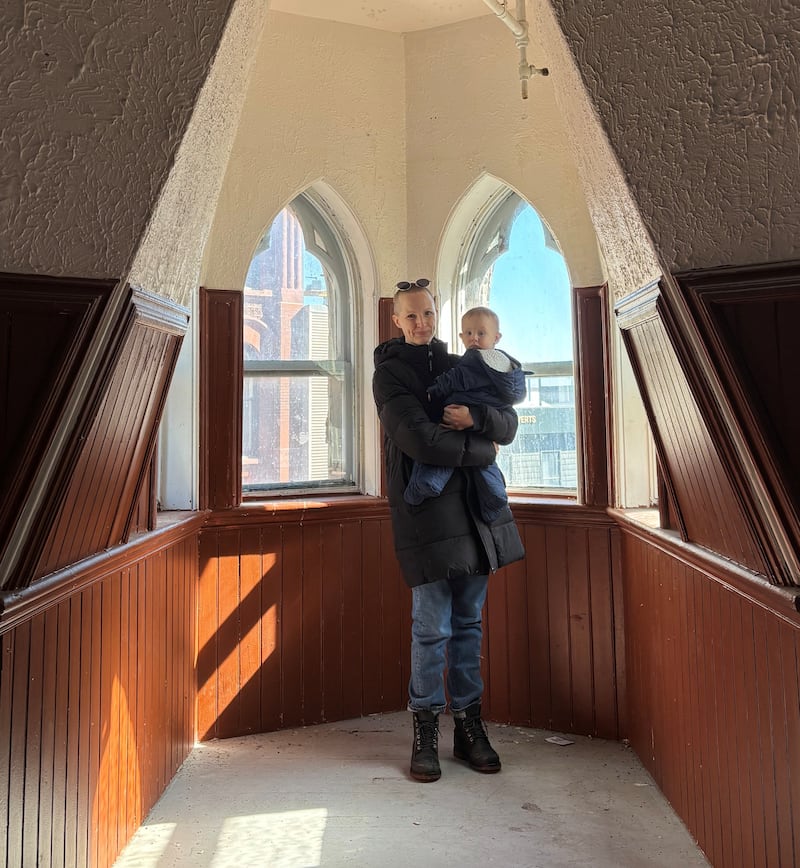 Rebecca Rose is pictured inside the turret at 1588 Barrington St. with her baby. (Courtesy of Rebecca Rose)