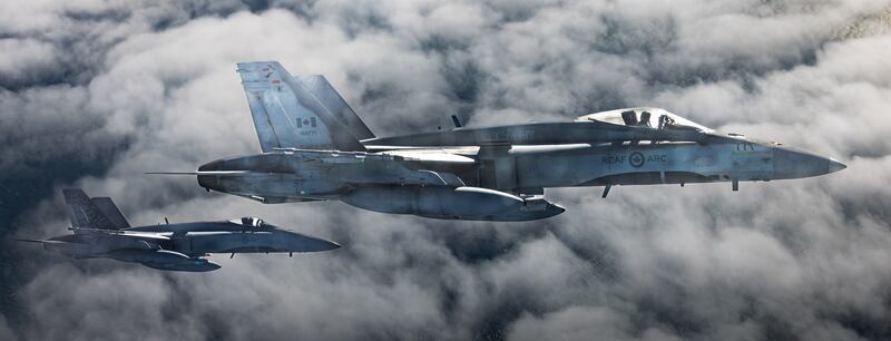 An RCAF C-130 refuels a pair of Canadian CF-18's during Exercise Cobra Warrior on Sept. 16, 2025.