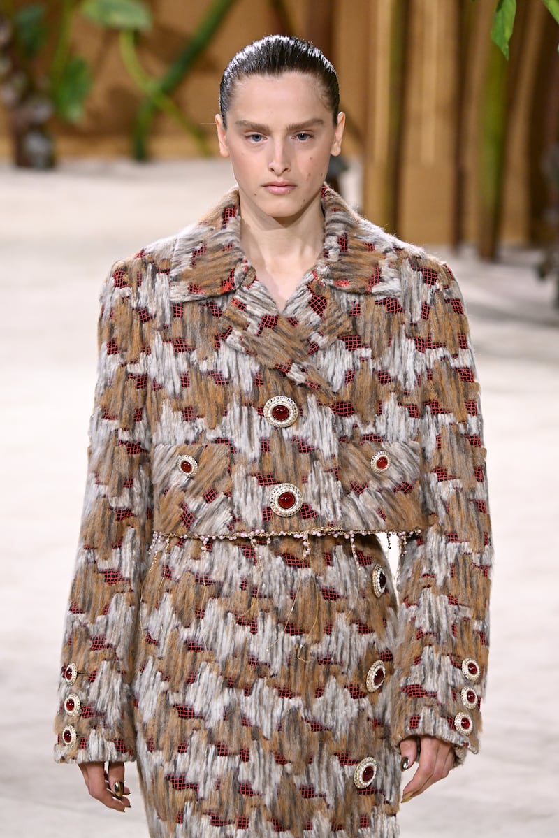 A model wears a creation as part of the Chanel Haute Couture Fall/Winter 2026-27 Women's collection presented in Paris on July 7, 2026. (Emma Da Silva / AP Photo)