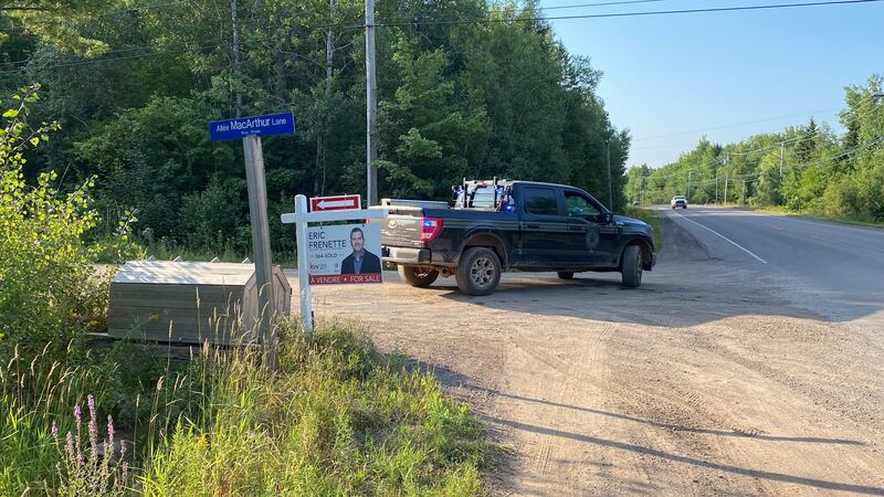 An emergency vehicle is pictured parked in front of MacArthur Lane in Moncton, N.B., during a wildfire in the area. (Derek Haggett/CTV Atlantic)