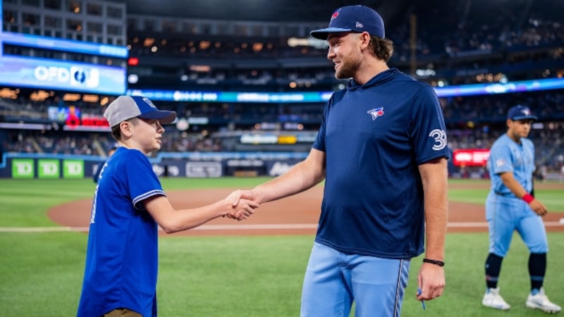 Blake Savage is pictured meeting Toronto Blue Jays pitcher Trey Yesavage. (Source: Toronto Blue Jays)