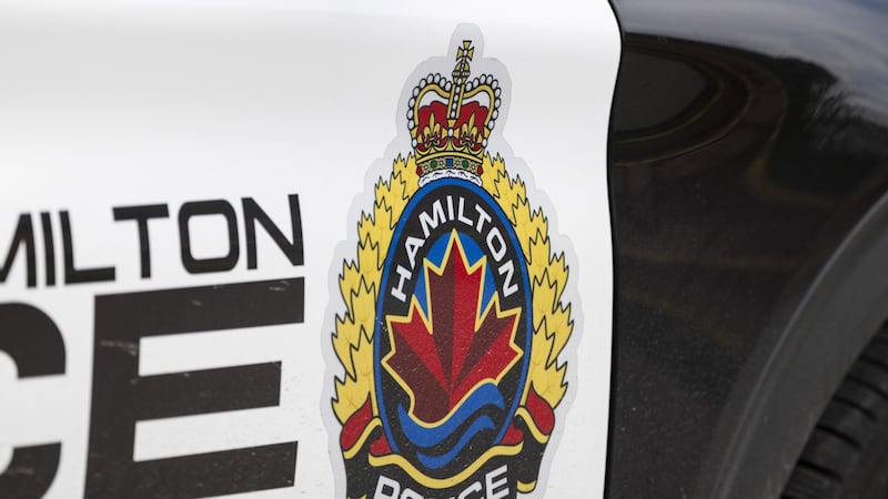 Man accused of crashing stolen U-Haul into Hamilton police cruisers and home