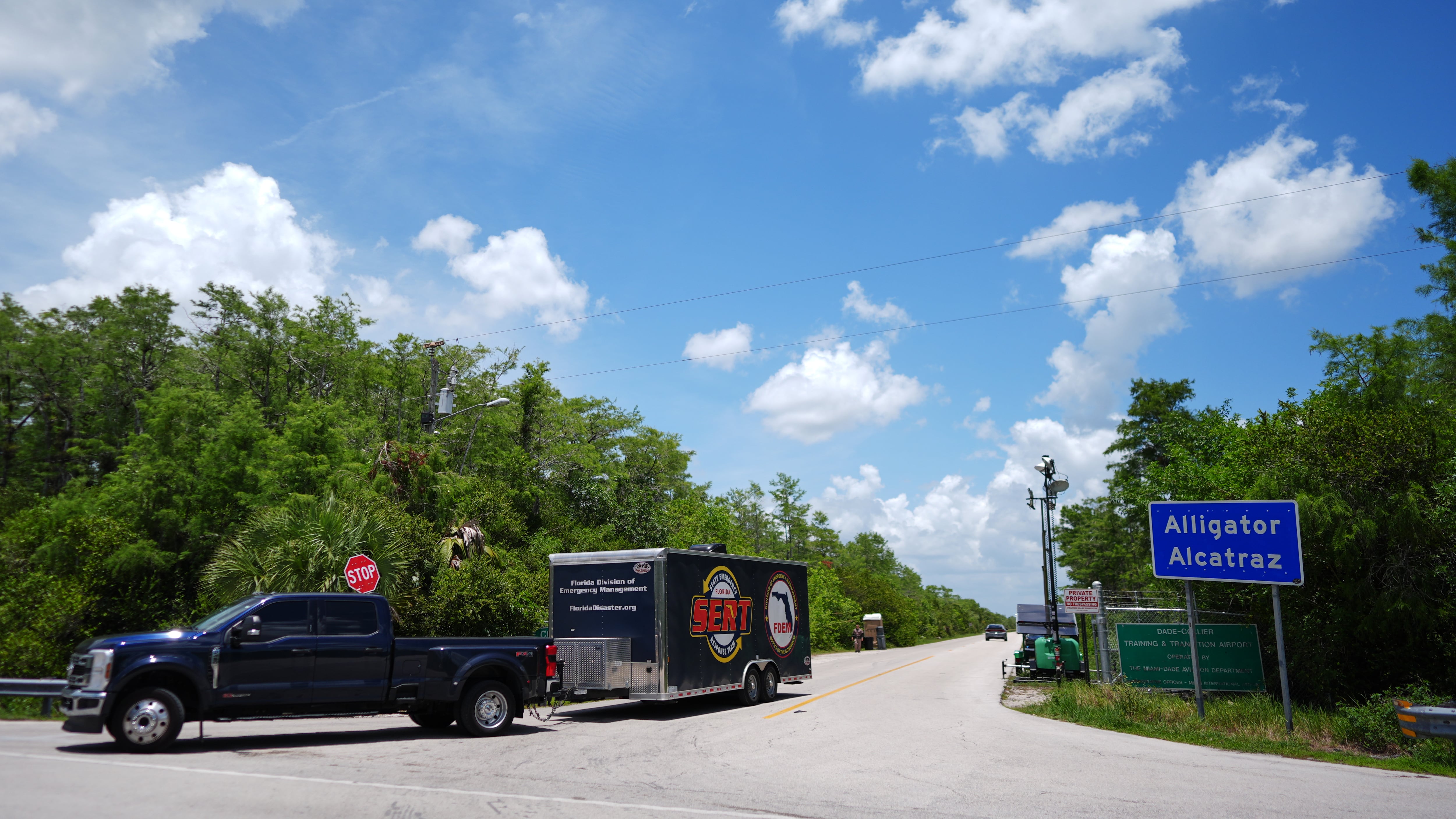 A pickup pulling a trailer leaves the "Alligator Alcatraz" immigration detention centre in Ochopee, Fla., on May 26, 2026. (Rebecca Blackwell / AP Photo)