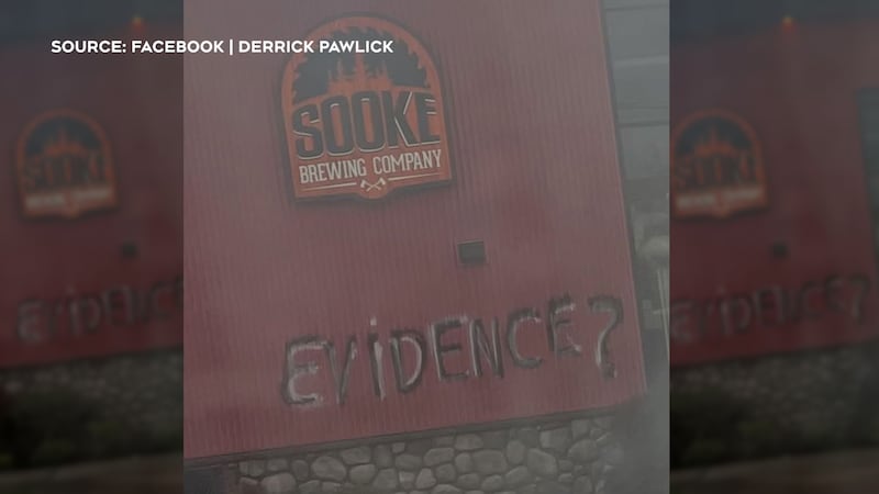 Spray painted graffiti is visible on the side of the Sooke brewery as RCMP investigate the vandalism.