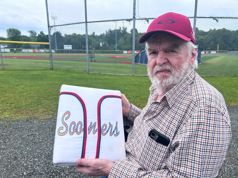 Jim "Rico" McEachern holds a scrapbook gifted to him on his 25-year anniversary with the Sooners back in 2001. Pictured on July 10, 2026. (Ryan MacDonald/CTV News Atlantic)