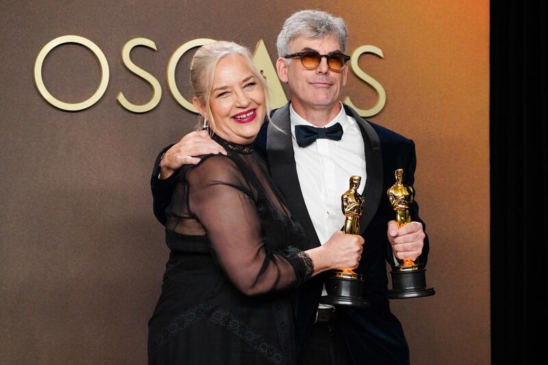 Tamara Deverell, left, and Shane Vieau, winners of the award for production design for "Frankenstein," pose in the press room at the Oscars on Sunday, March 15, 2026, at the Dolby Theatre in Los Angeles. (Photo by Jordan Strauss/Invision/AP)
