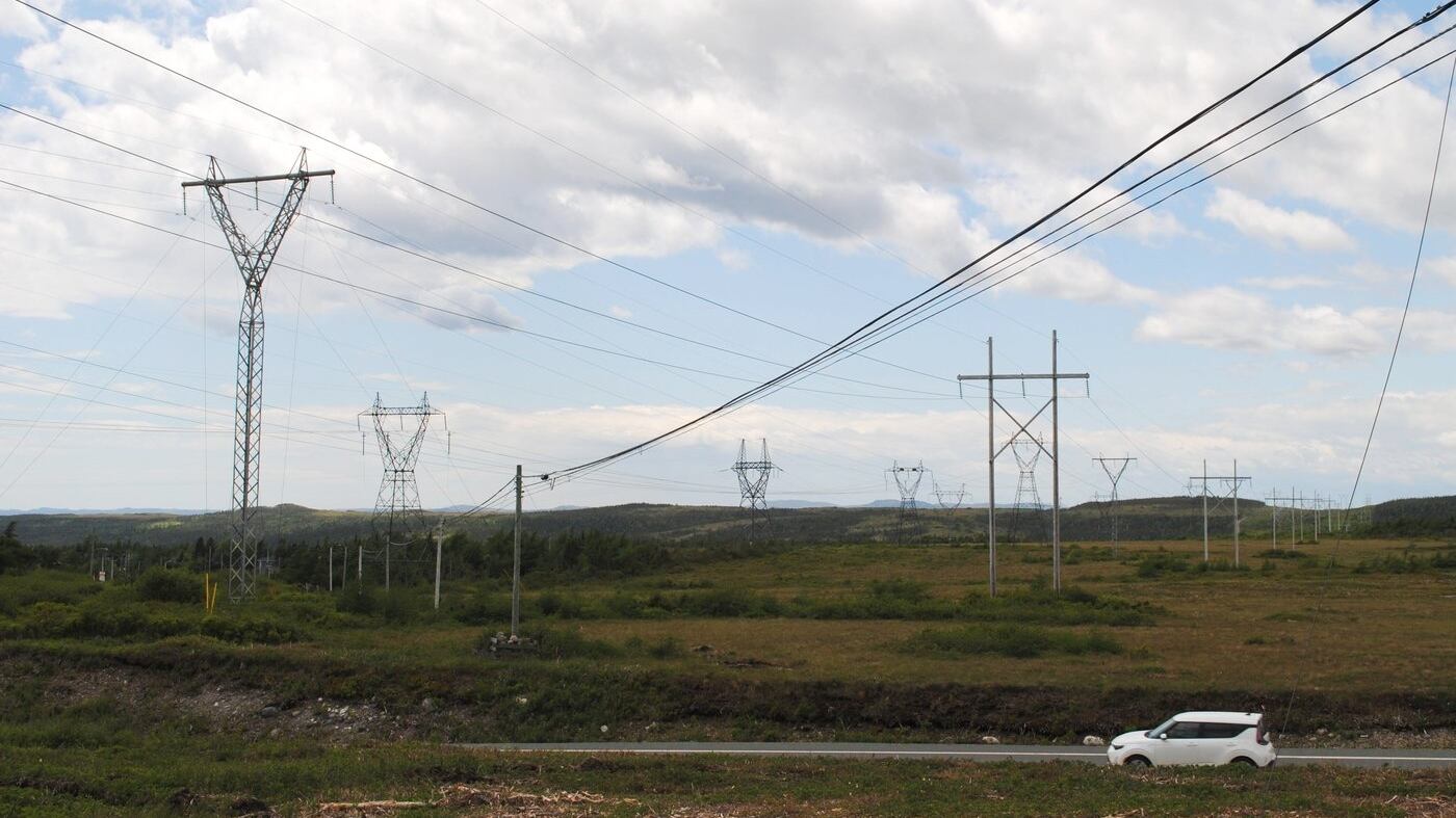 A car is shown driving by a valley of power lines near Come By Chance, N.L., on Saturday, June 28, 2025. Newfoundland and Labrador Hydro says it will soon be looking for companies to provide renewable energy to the province's power grid. THE CANADIAN PRESS/Sarah Smellie