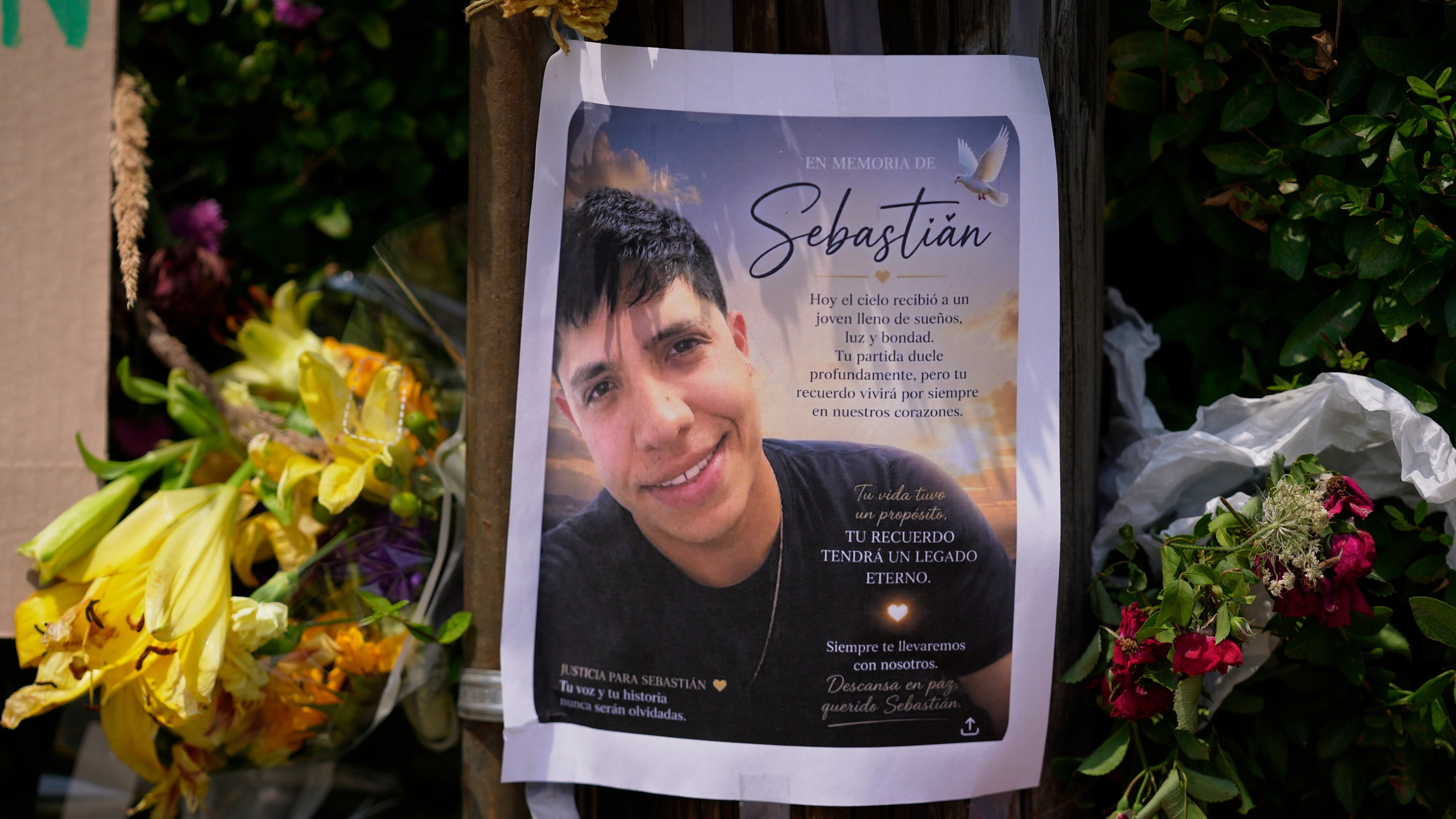 A poster of Johan Sebastian Duran Guerrero, the man killed by U.S. Immigration and Customs Enforcement, is displayed among flowers and tributes at a makeshift memorial in Biddeford, Maine on July 15 2026. (Robert F. Bukaty / AP Photo)