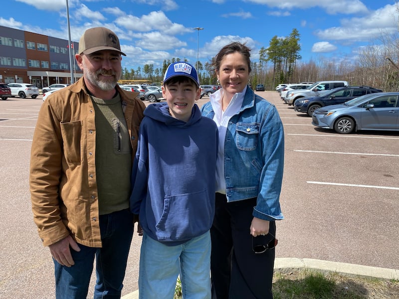 Blake Savage is pictured with his parents outside of Maplehurst Middle School in Moncton, N.B. (CTV Atlantic / Derek Haggett)