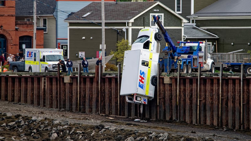 Tow truck picks up ambulance