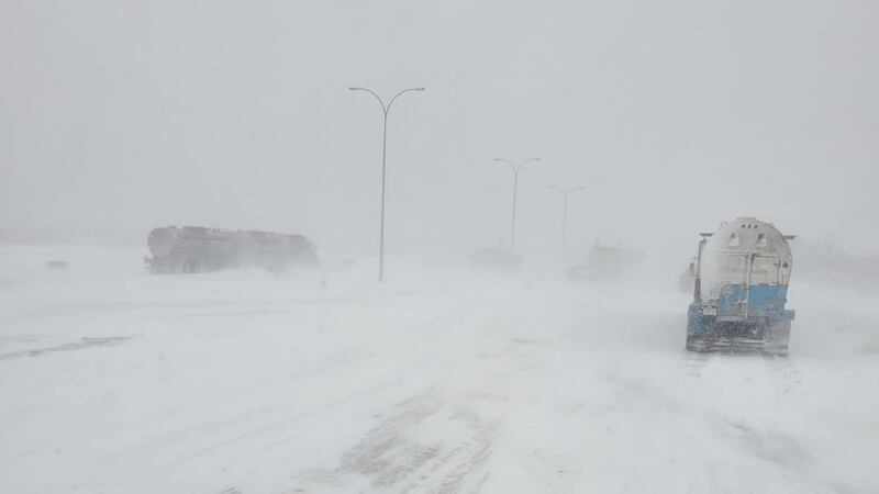 Multiple semis are seen on Highway 63 on April 23, 2026, stranded due to a snow storm and multiple crashes on the Alberta highway leading to Fort McMurray. (Source: Dana Wiseman)