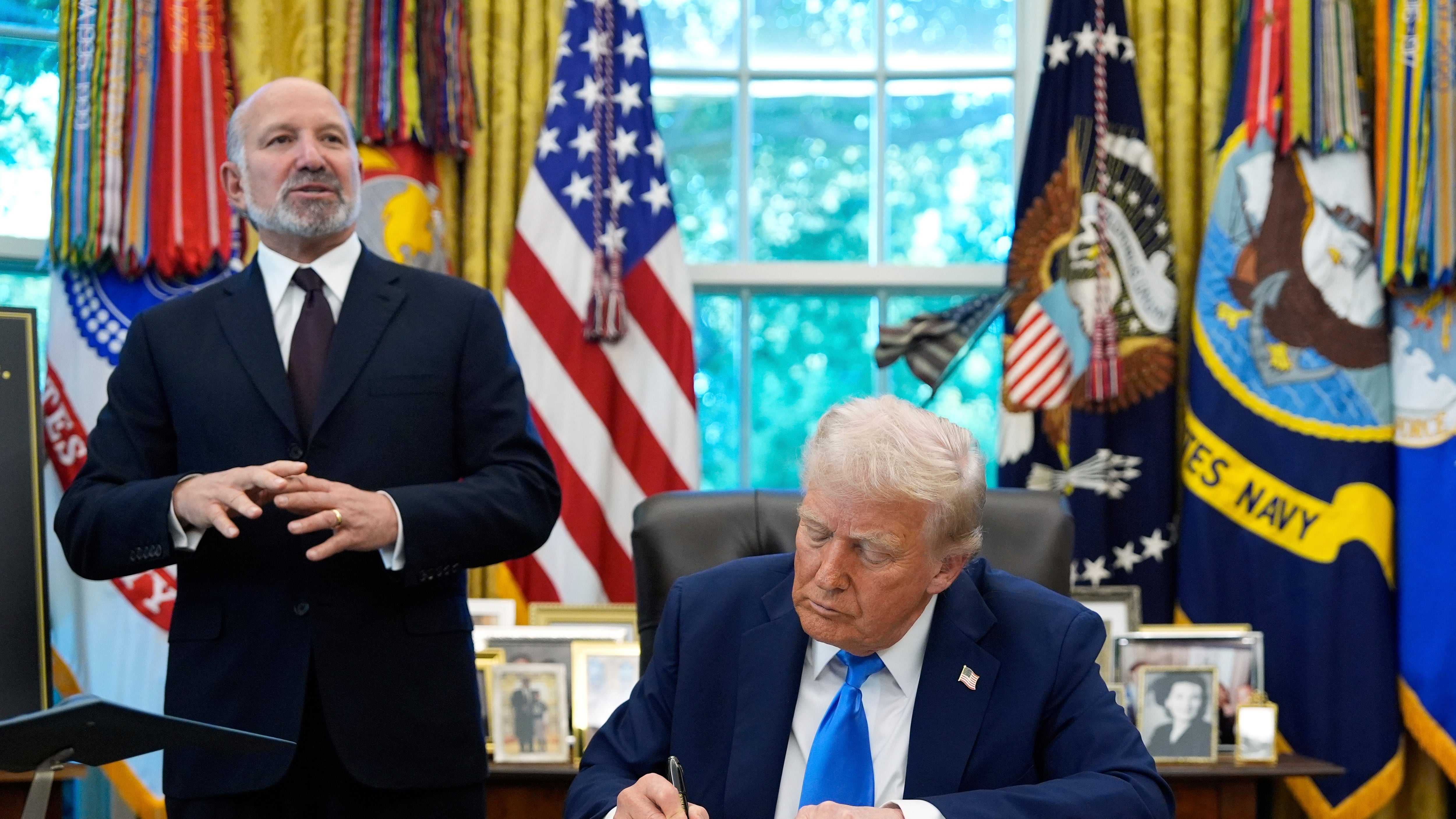 Commerce Secretary Howard Lutnick speaks as U.S. President Donald Trump signs the Gold Card executive order in the Oval Office of the White House in Washington on Sept. 19, 2025. (Alex Brandon / AP Photo)