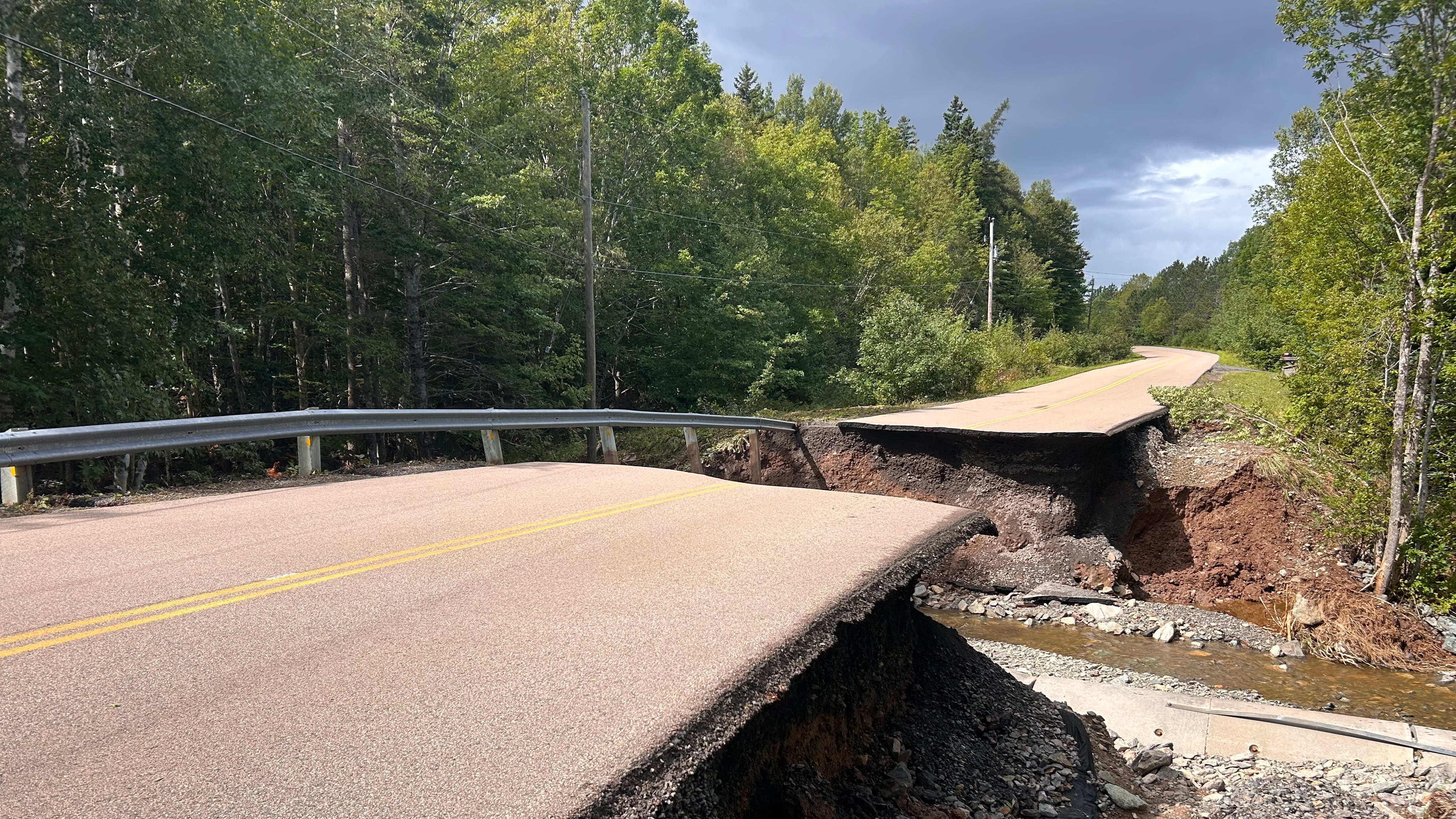 A washout on the road between St. Peter's and Dundee in Cape Breton following severe flooding. (CTV/Ryan MacDonald)