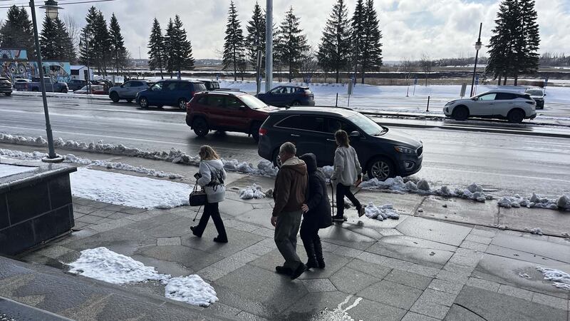 Pat and Peter Price are pictured walking away from Moncton provincial court on April 2, 2026. (CTV Atlantic / Derek Haggett)