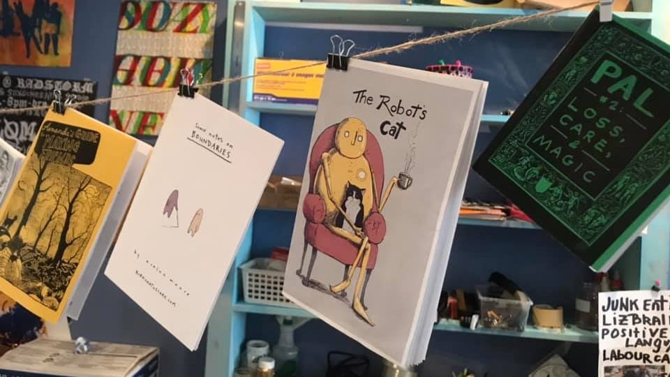Zines are pictured.