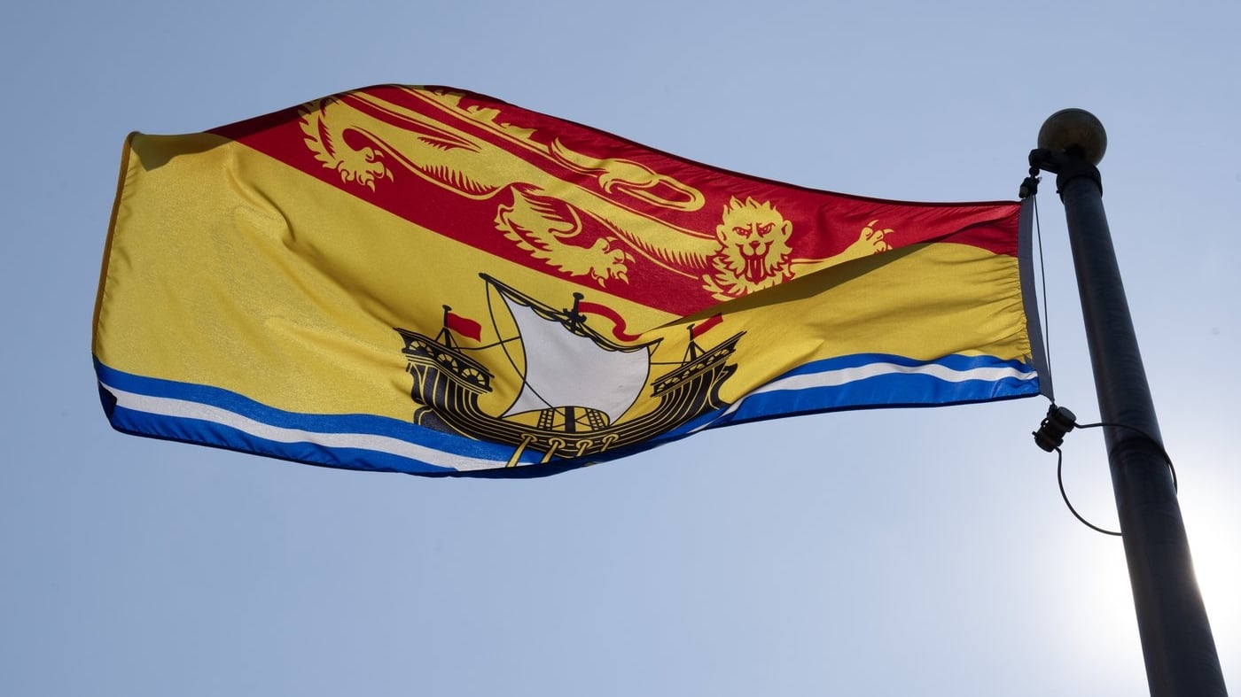 The New Brunswick provincial flag flies on a flagpole in Ottawa, Friday, July 24, 2026 in Ottawa. THE CANADIAN PRESS/Adrian Wyld