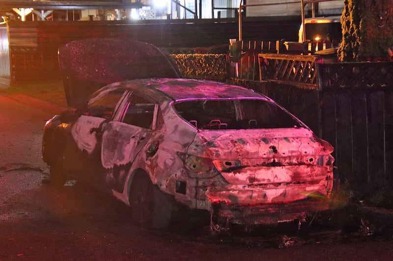 A burned vehicle was discovered roughly 45 minutes after the shooting in an alleyway several blocks from the scene of the gunfire.