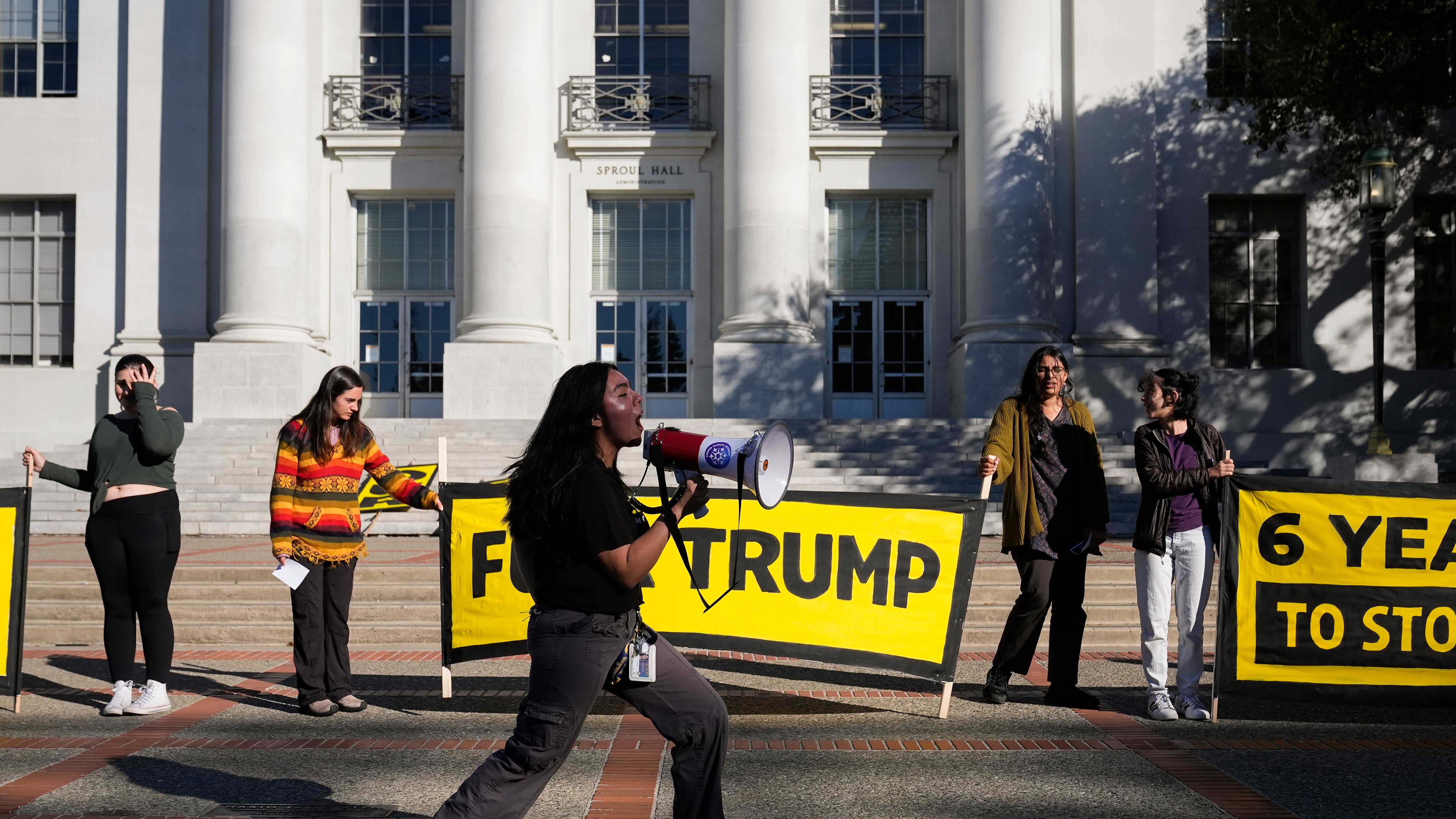 University of California Berkeley student Ariela Lara, centre, leads a chant as students hold signs while protesting the re-election of Donald Trump on the campus of the University of California Berkeley in Berkeley, Calif., on Nov. 15, 2024. (Godofredo A. Vásquez / AP Photo)
