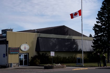 A flag flies at half-mast at the Royal Canadian Legion in Wainwright, Alta., after four Canadian Armed Forces members, Sgt. Morgan Wong of Edmonton, Pte. Shaun Farrell of Prince Albert, Sask., Pte. Aidan Goulding of North Vancouver, B.C., and Pte. Hayden Lykkemark of Langley, B.C., died Saturday during a training exercise at CFB Wainwright, on Monday, Oct. 19, 2026. THE CANADIAN PRESS/Christopher Katsarov