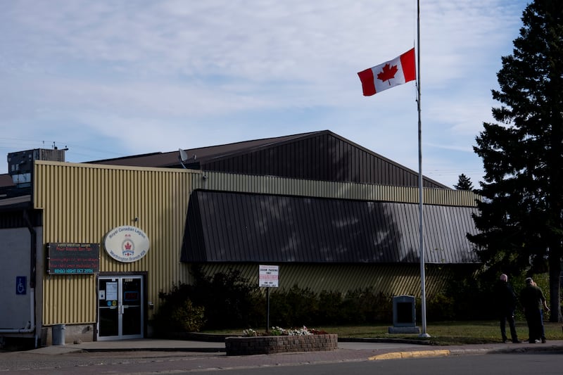 A flag flies at half-mast at the Royal Canadian Legion in Wainwright, Alta., after four Canadian Armed Forces members, Sgt. Morgan Wong of Edmonton, Pte. Shaun Farrell of Prince Albert, Sask., Pte. Aidan Goulding of North Vancouver, B.C., and Pte. Hayden Lykkemark of Langley, B.C., died Saturday during a training exercise at CFB Wainwright, on Monday, Oct. 19, 2026. THE CANADIAN PRESS/Christopher Katsarov