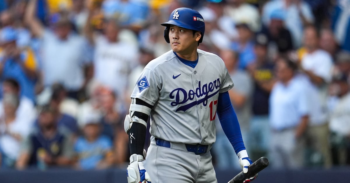 Photo: CP24 Los Angeles Dodgers designated hitter Shohei Ohtani walks to the dugout after striking out during the first inning of Game 2