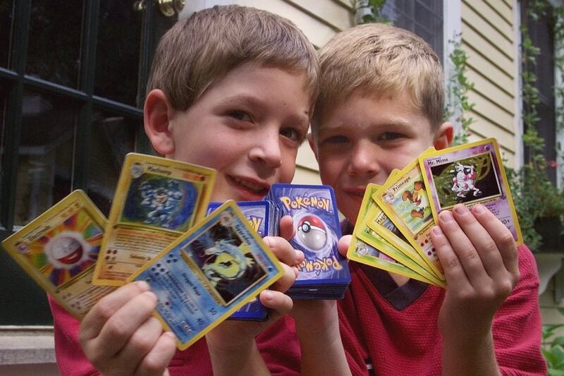 holding pokemon cards 4 Pocket Oversized Card Binder Meet The Gen Z Girls
