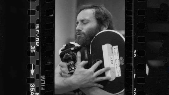 Mike Jones hugs a camera