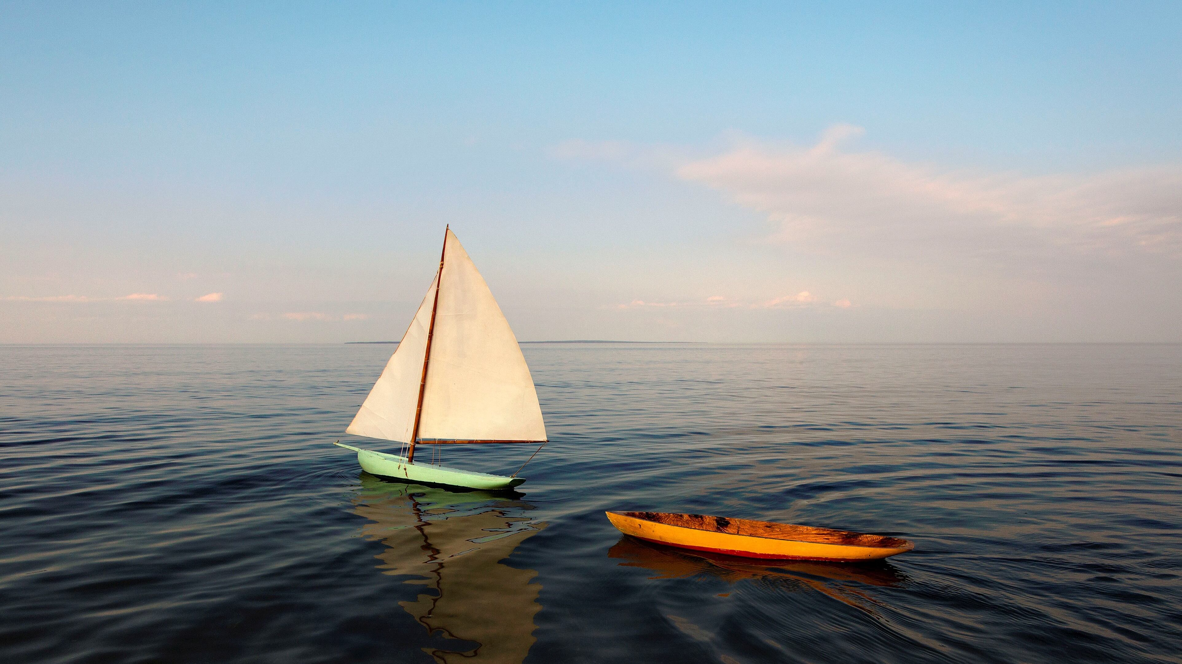 A miniature sloop and hull