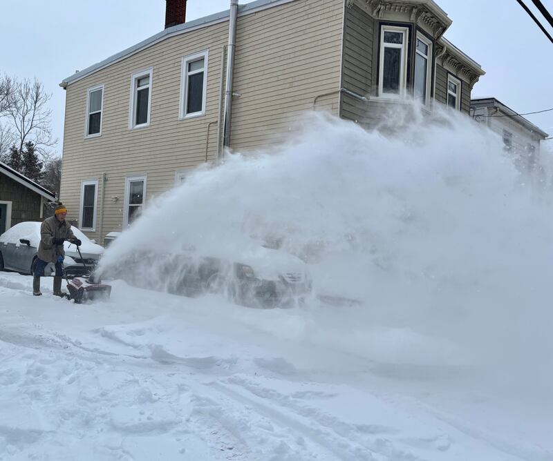 A man snow blows his driveway on Charles Street in Halifax on Jan. 26, 2026. (Jesse Thomas/CTV Atlantic)
