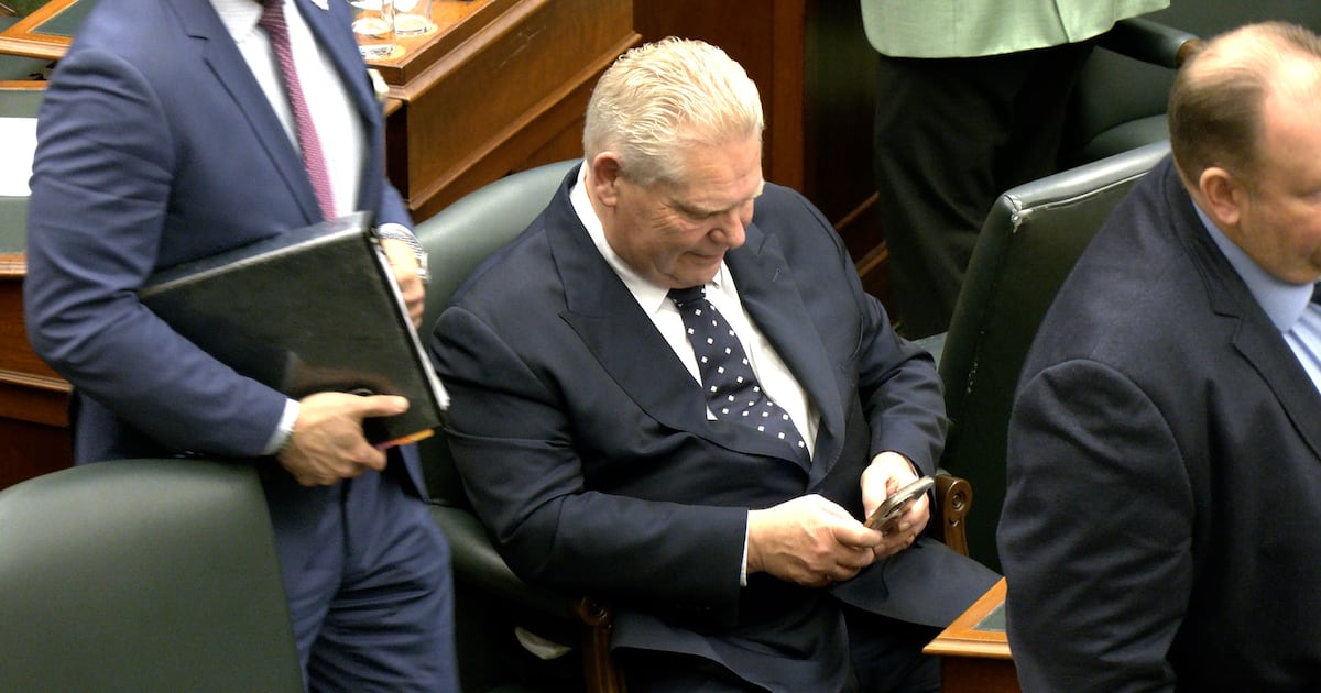 Premier Doug Ford looks at his cellphone in the legislature at Queen's Park. (CTV Toronto)