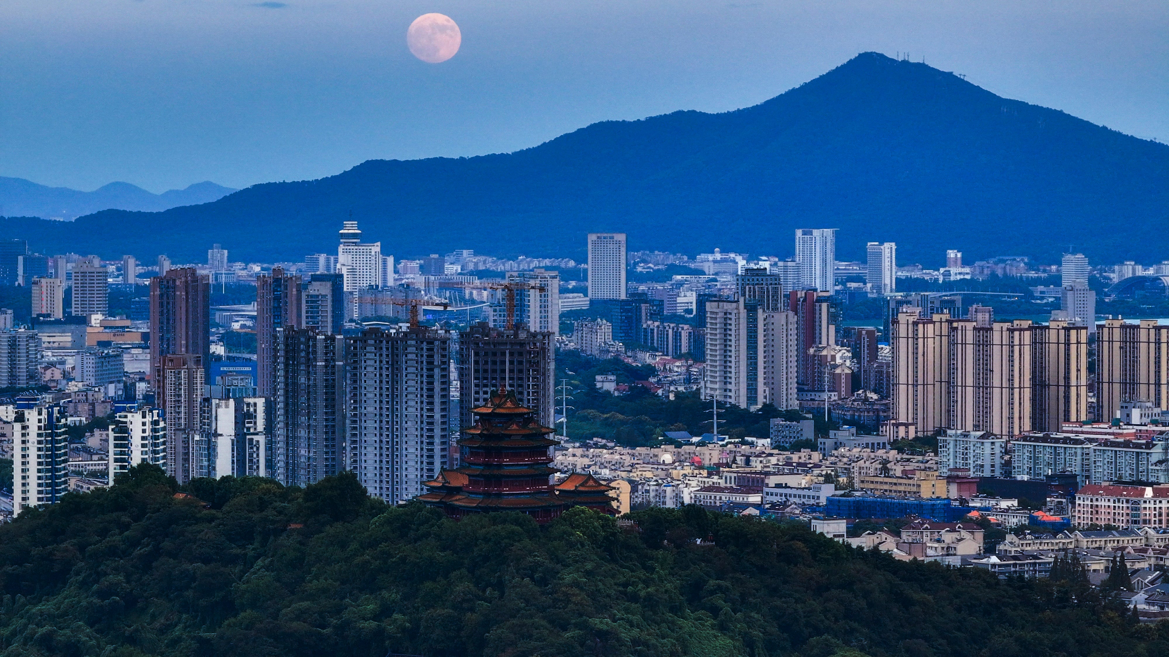 A supermoon rises over the city in Nanjing, in east China's Jiangsu province, on Sept. 17, 2024. (Chinatopix Via AP)