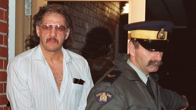 Allan Legere departs from court in Burton, New Brunswick, as he waits for jurors in his murder trial to return a verdict in Burton, N.B. on Nov. 2, 1991. (The Canadian Press/Andrew Vaughan)
