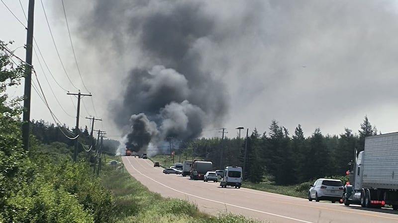 Smoke billows from the scene of a collision on Route 16 in the Melrose, N.B., area on July 7, 2026. (Submitted: Jodi Boland)