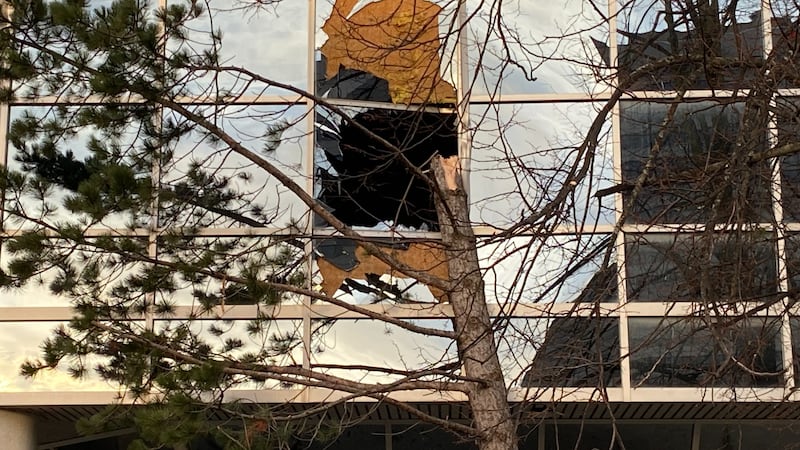 A building with a broken window is pictured.